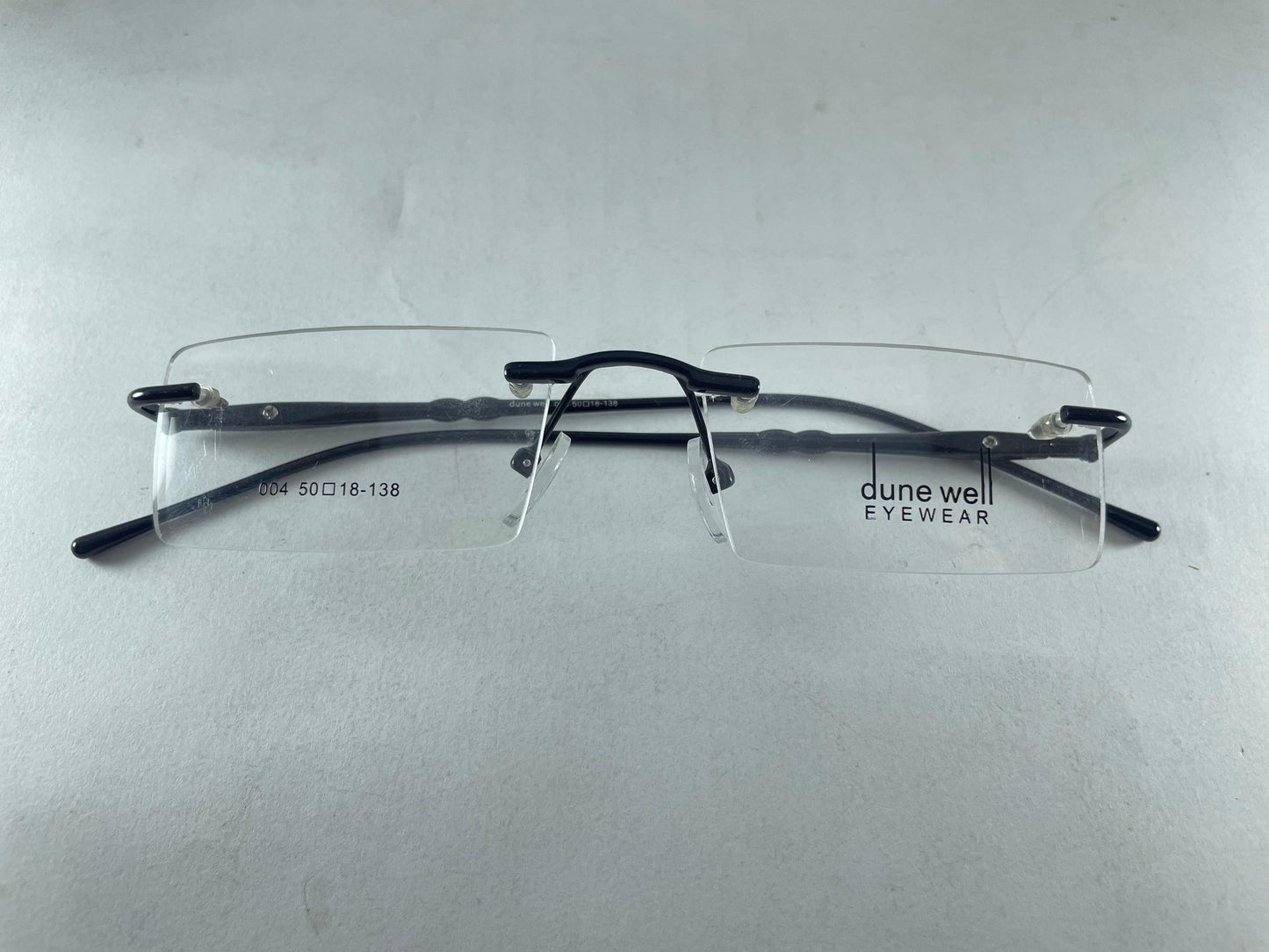 Rimless Specs.