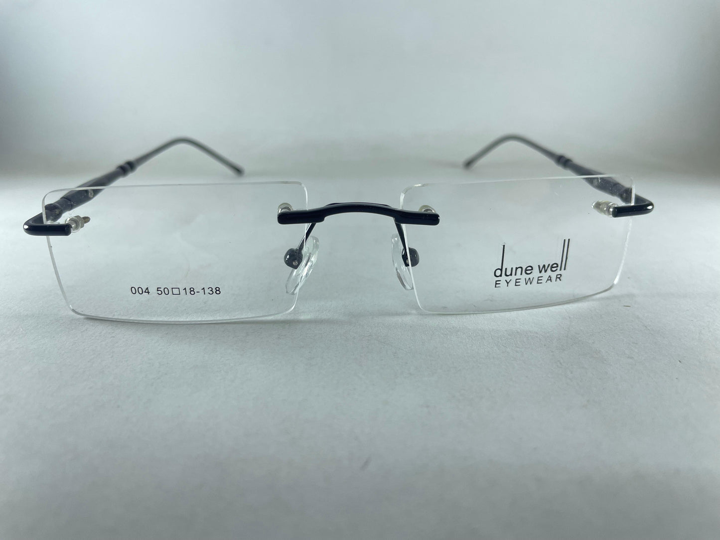 Rimless Specs.